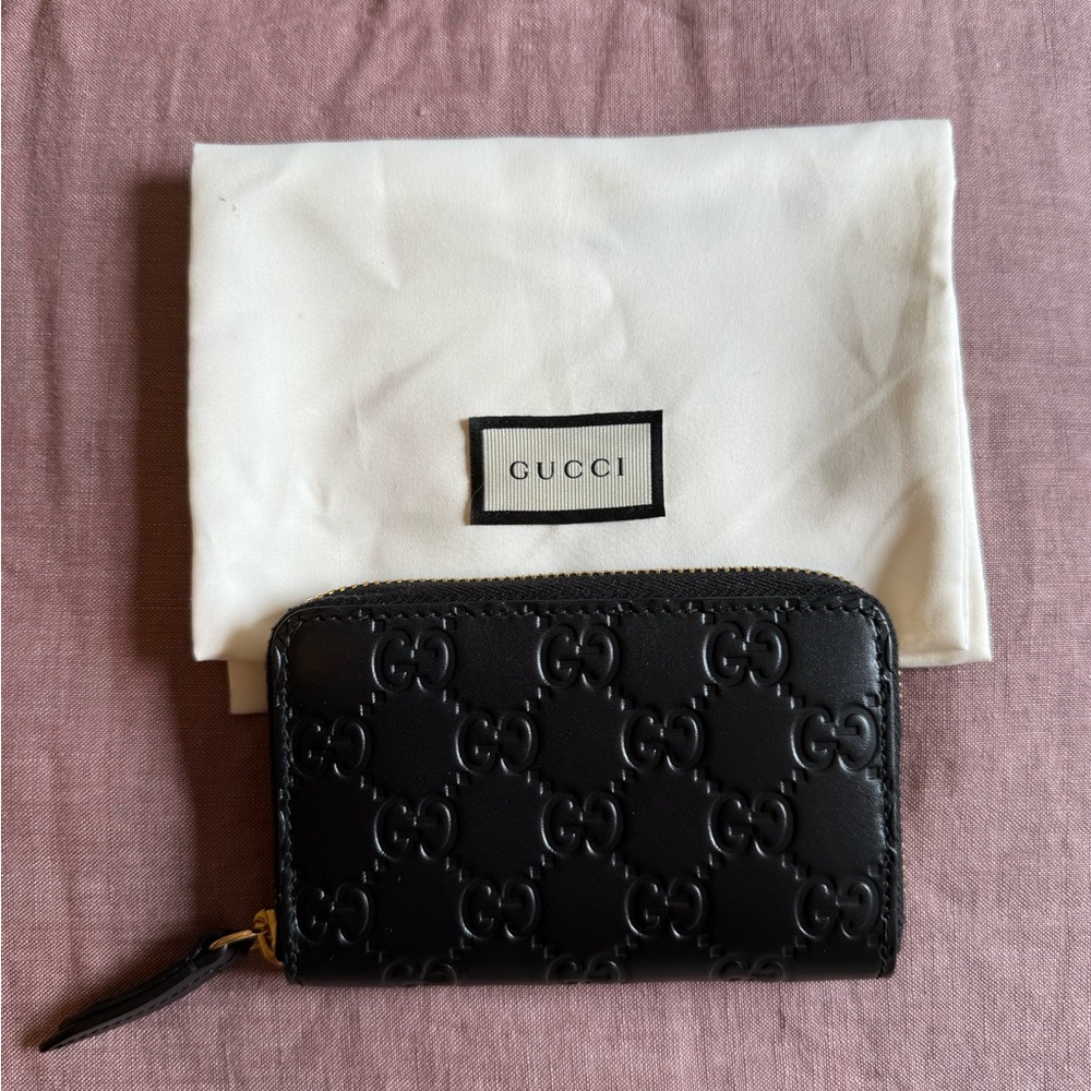 Gucci Black Leather Bags with Embossed Monogram